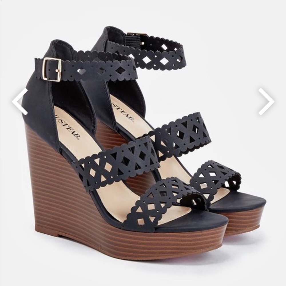 Woman’s black wedges
